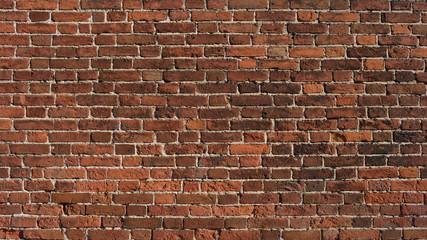 Old red brick wall dated by the end of 19th century. Ancient brick wall texture background