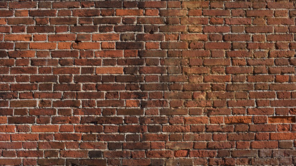 Old red brick wall dated by the end of 19th century. Ancient brick wall texture background