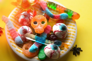 Halloween candies and jelly beans on the plate