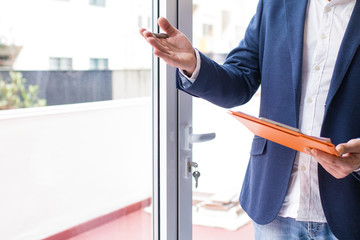 businessman signing documents in the office, real estate and mortgage concept