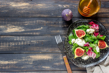 Salad with figs, cheese and honey. Healthy eating.