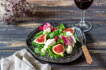 Salad with figs, cheese and honey. Healthy eating.
