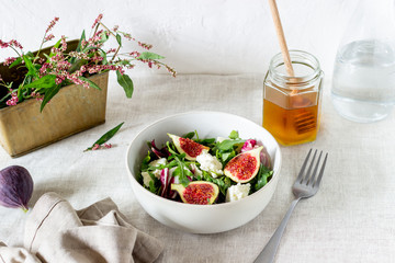 Salad with figs, cheese and honey. Healthy eating.