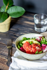 Salad with avocado and grapefruit. Healthy eating. Vegetarian food.