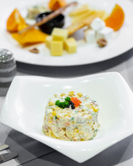 Salad salad with fresh vegetables and corn topped with mayonnaise