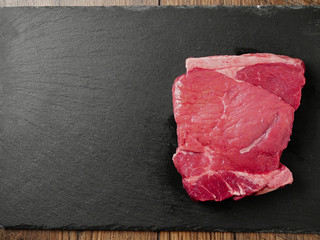 Sirloin uncooked steak on a slate plate, Copy space, Raw meat display.