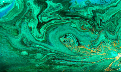 Green and gold ripples abstract background.