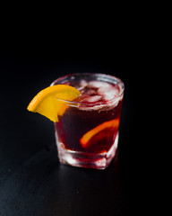 Grenadine cocktail toped with lemon slice