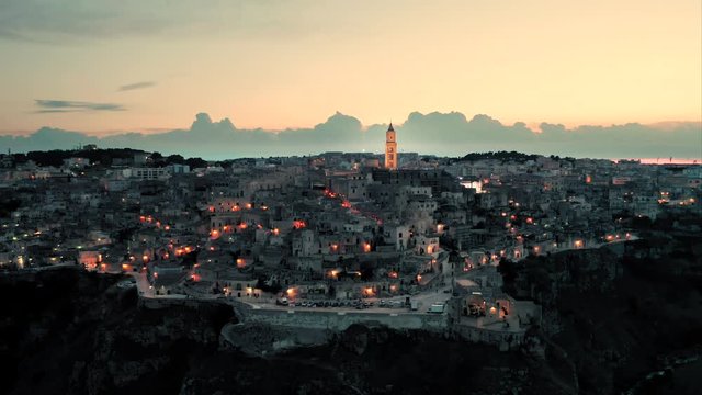 Beautiful evening shot of the historic old town of Matera, Basilicata, Italy - one of the fastest growing cities in the south of Italy and a european capital of culture. Aerial view. 