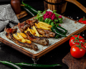 Roasted ribs with garnished potatoes