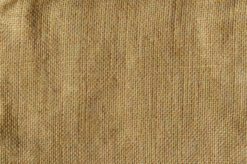 Detailed natural burlap background. Grunge khaki brown rough sackcloth fabric texture - obrazy, fototapety, plakaty
