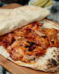 Roasted chicken slices in tortilla