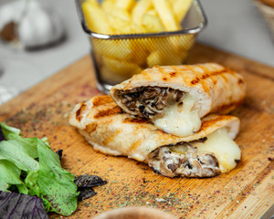 Wrap filled with mushroom and cheese