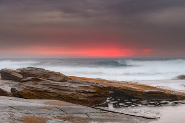 Moody Sunrise Rocky Seascape