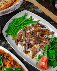 Creamy salad topped with spicy meat