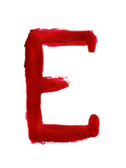 Large letter E of English or Russian alphabet handwritten by dark red color melted lipstick. Roman...