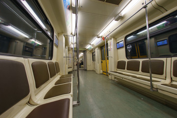 Subway carriage interior. Almost no people in the metro in the end of day. Last travelers only.