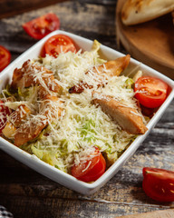 Caesar salad with chicken fillet slices