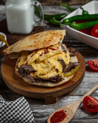 Meat in bread with melted cheese
