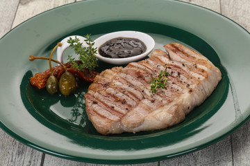 Grilled pork steak with pepper sauce