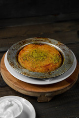 Turkish dessert kunefe topped with pistachio