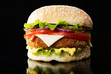 Delicious fast food. Burger on a wooden board