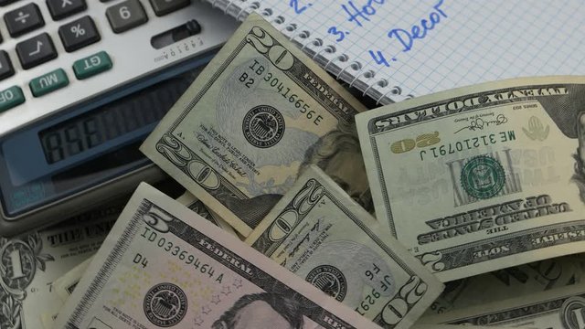 Monthly budget planner book, dollars and calculator. Christmas budget planning, background
