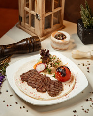 Meat steak with fried tomato