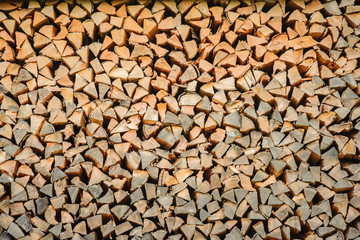 An array of firewood for burning in a stove is piled.