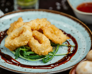 Donuts with caramel syrup and herbs
