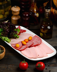 Mix of sausages served with basil