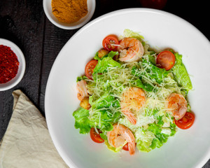 Shrimp salad with lettuce topped with cheese