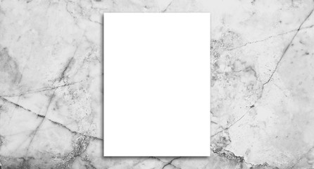 White poster on marble wall. or blank paper labels on the tile wall.Information promoting ideas for marketing announcements and details.