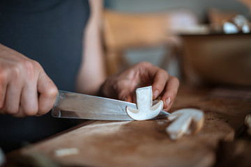 Slicing white mushroom. Preparation for drying