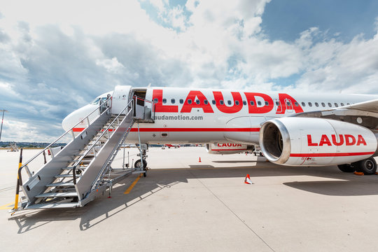21 July 2019, Vienna, Austria: Lauda commercial airplane waiting for boarding passengers in Schwechat airport
