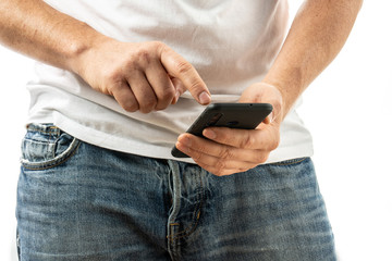 A man is typing on a smartphone
