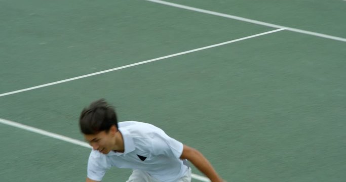 Tennis player tries hard to stretch but misses.