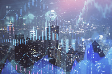 Double exposure of forex chart drawings over cityscape background. Concept of success.