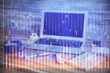 Double exposure of chart and financial info and work space with computer background. Concept of international online trading.