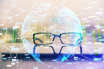 Business theme hologram with glasses on the table background. Concept of search. Double exposure.