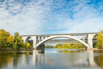 Naklejka premium Kouvola, Finland - 25 September, 2019: Autumn landscape of bridge and Kymijoki river waters in Finland, Kymenlaakso, Kouvola, Koria