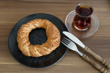 Turkish pastry products are Pogaca, Simit at patisserie on the wooden background.