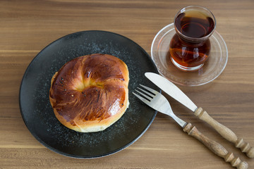 Turkish pastry products are Pogaca, Simit at patisserie on the wooden background.