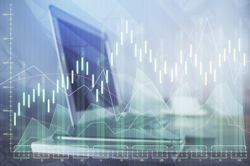 Double exposure of chart and financial info and work space with computer background. Concept of...