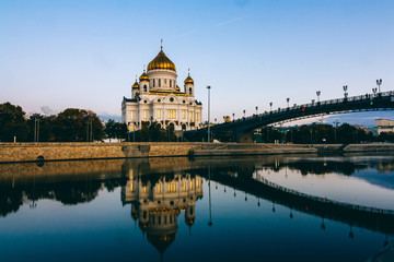 View from bridge to the Cathedral of Christ the Savior. moscow sightseeing in the morning. Beautiful white orthodox temple in Russian-Byzantine style with golden domes