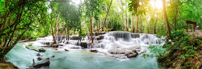 Travel to the beautiful waterfall in tropical rain forest, soft water of the stream in the natural...