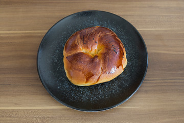 Turkish pastry products are Pogaca, Simit at patisserie on the wooden background.