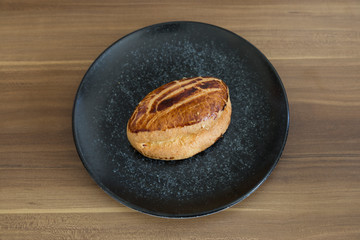 Turkish pastry products are Pogaca, Simit at patisserie on the wooden background.