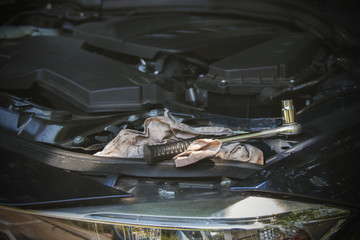 tools on the car engine in the workshop