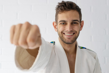 young sportsman with his fist in the foreground